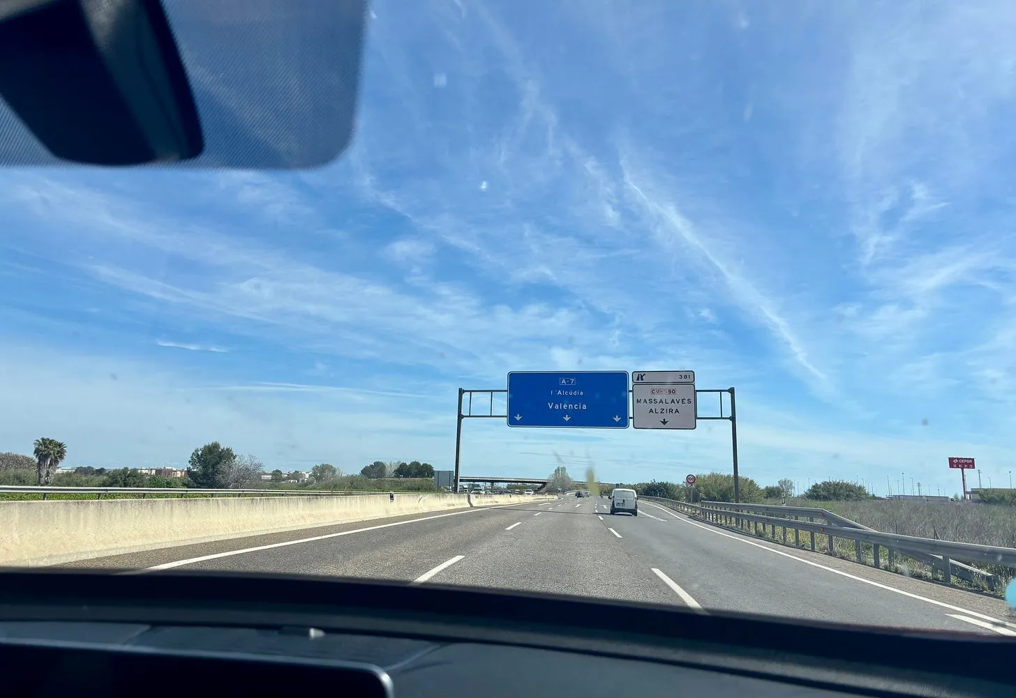 A sunny Spanish motorway seen through the car windscreen