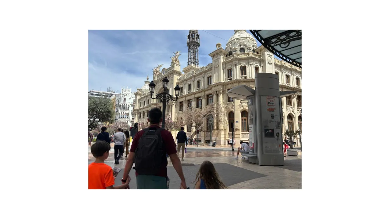 Walking past grand old buildings in Valencia city centre